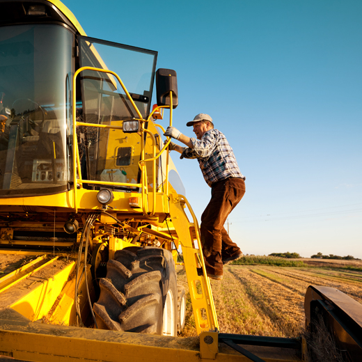 truck and a driver in a farmm field